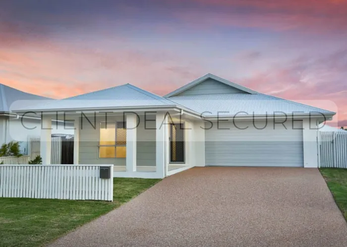 A white house with a white picket fence.