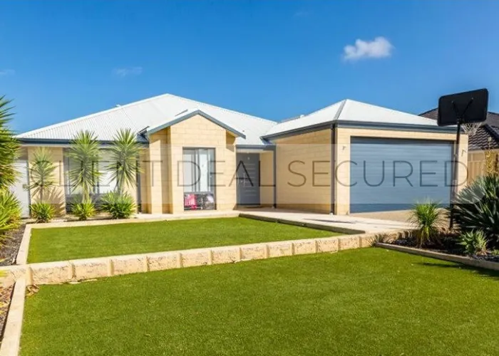 A house with a lawn in front of it.