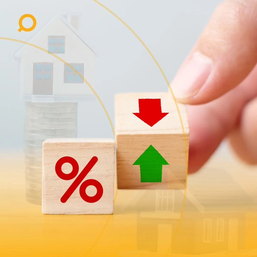 Wooden blocks with percentage and up/down arrows, representing interest rate changes