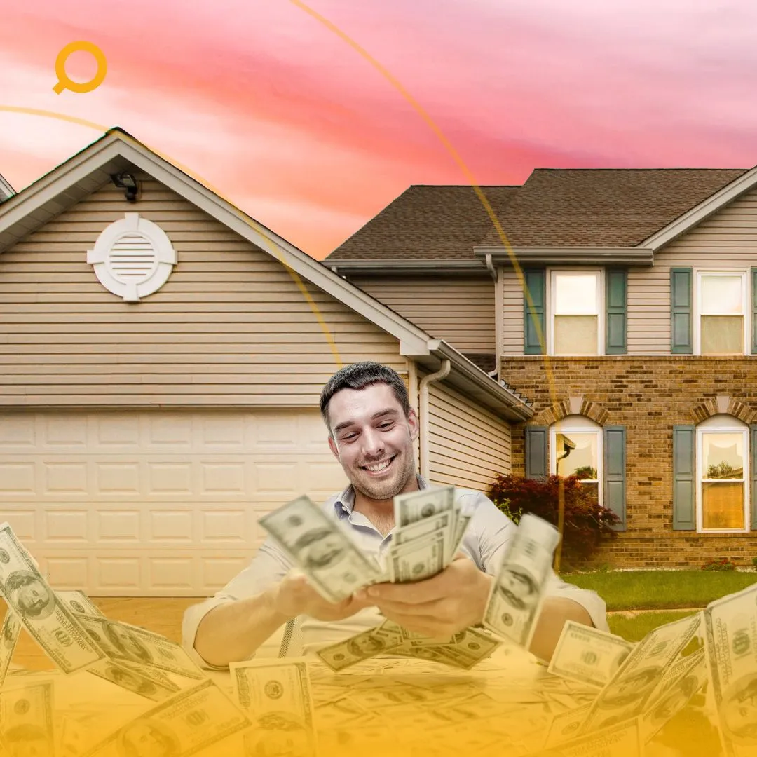 happy man holding a large amount of cash in front of a suburban house