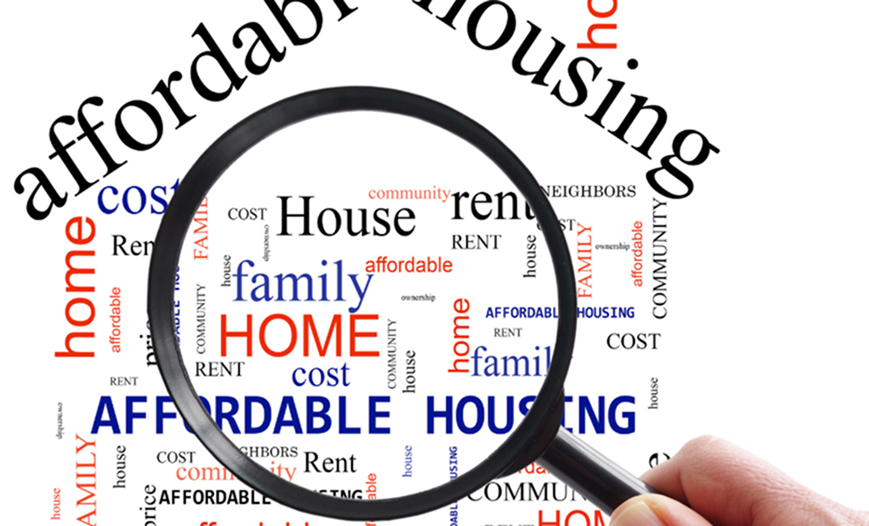 Magnifying glass over "affordable housing" word cloud