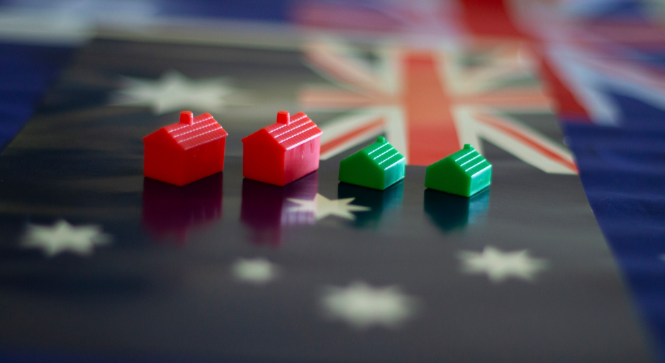 Australian flag with red and green Monopoly houses