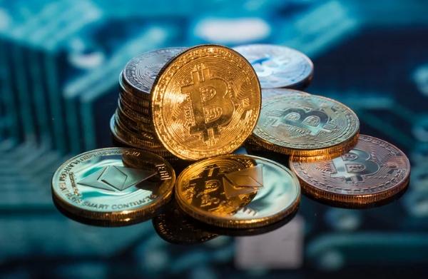 Gold Bitcoin and Ethereum coins stacked on a digital circuit background.
