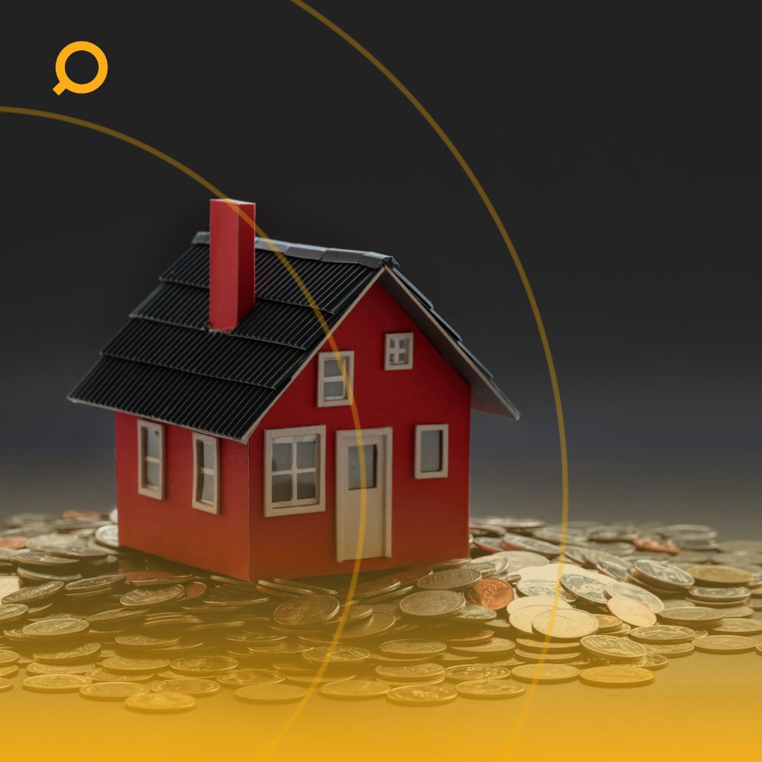 A model house sits atop a pile of coins, with a guide title on capital gains tax for investment properties in the foreground.