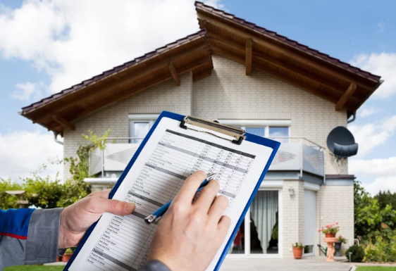 A person holds a clipboard with a checklist, inspecting a modern Australian house with a satellite dish and garden in the background.