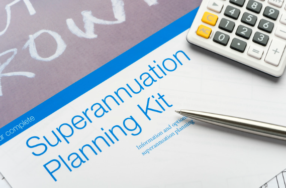  Close-up of a "Superannuation Planning Kit" document, a calculator, and a pen, highlighting retirement planning tools.