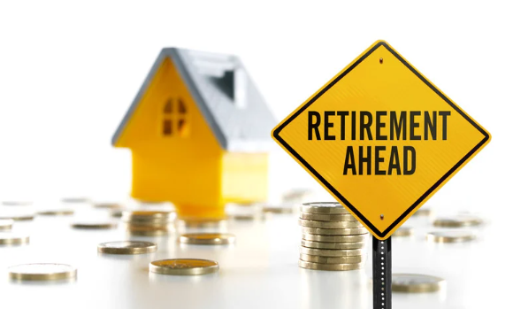 A miniature house beside stacked coins and a 'RETIREMENT AHEAD' sign, illustrating retirement planning and property investment in Australia.