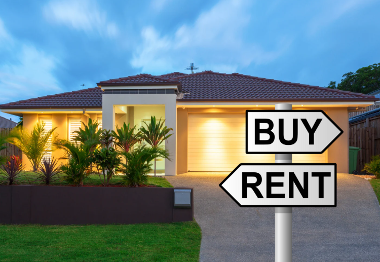 A modern home illuminated at dusk with a signpost indicating "BUY" and "RENT" directions, surrounded by lush greenery.