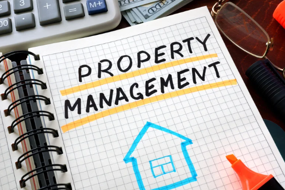 Notebook with handwritten 'Property Management' title and house sketch, representing real estate administration and landlord services.