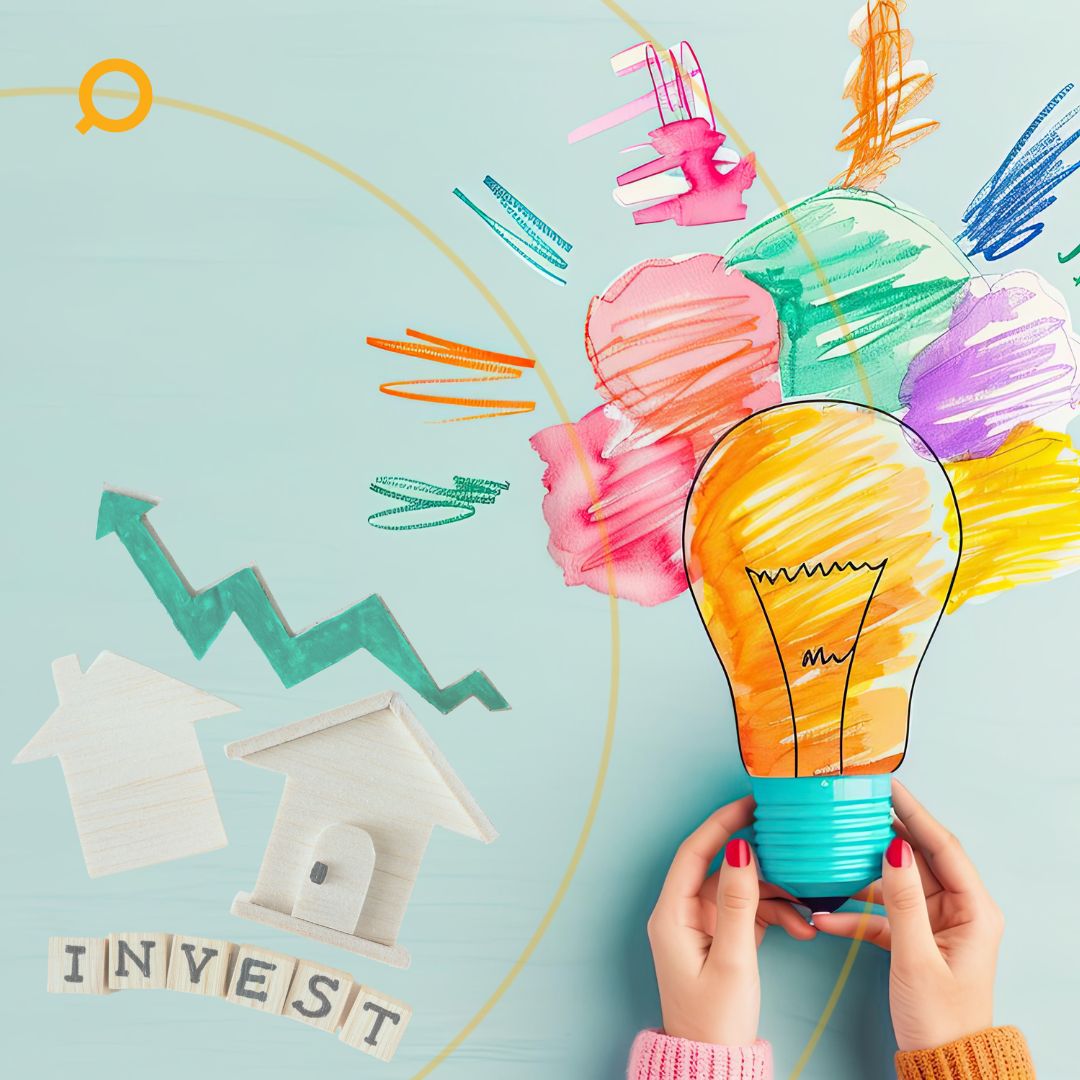 Creative concept of real estate investment with hands holding a colourful lightbulb, house icons, upward arrow, and scrabble letters spelling ‘INVEST’.