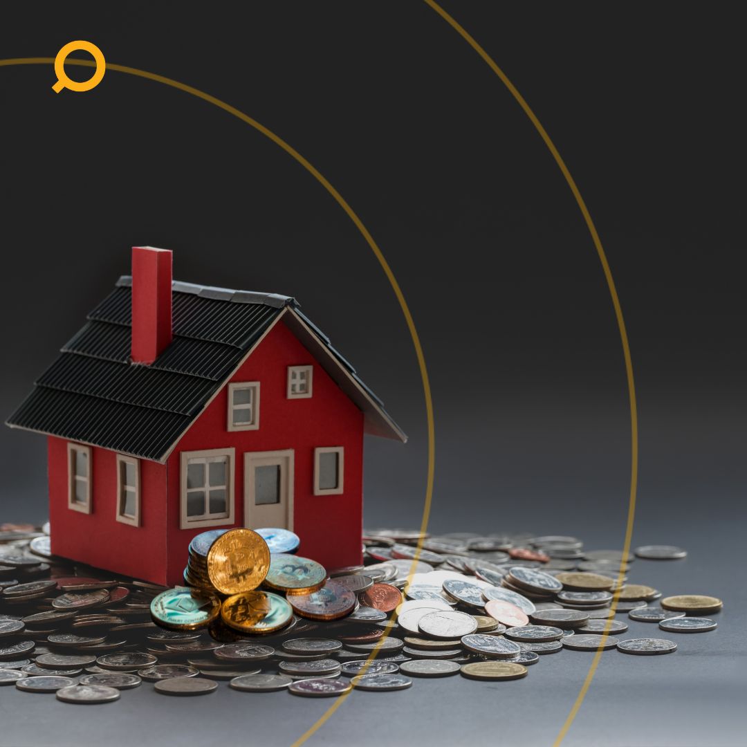 Small red model house placed on a pile of assorted coins, symbolizing real estate investment, property value, and housing finance on a dark background with gold graphic elements.