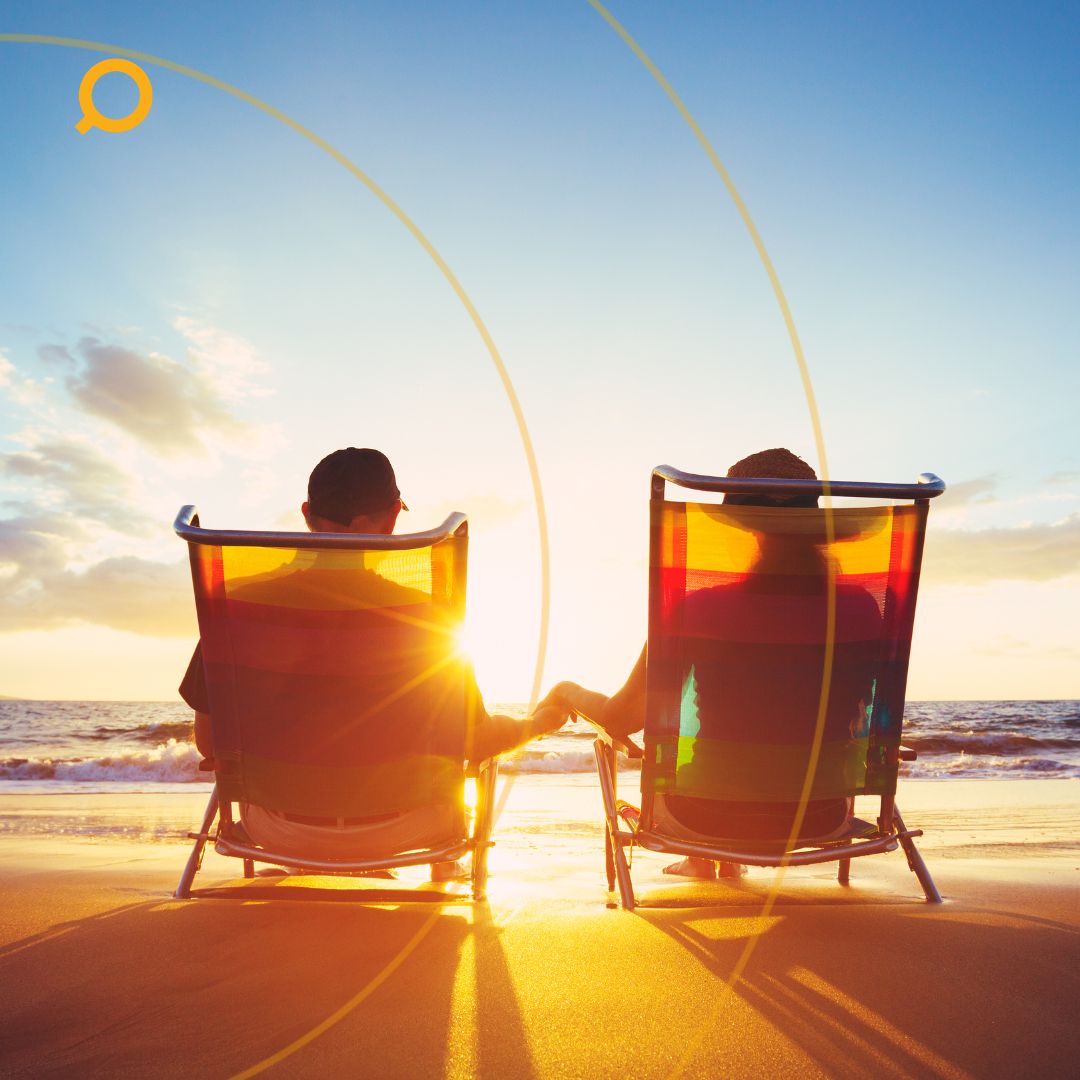 retire couple seating through the sunset