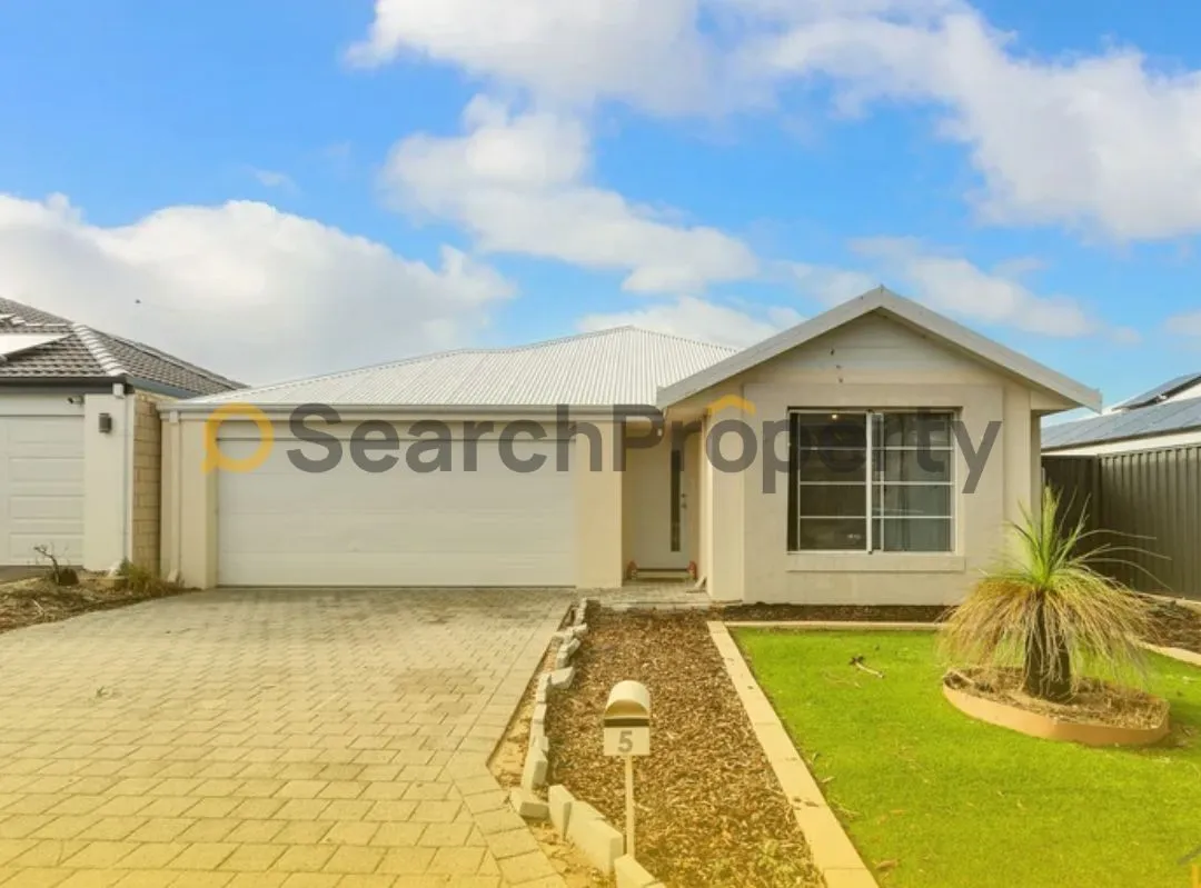 Modern single-storey Australian home with double garage, manicured front lawn, and low-maintenance landscaping.