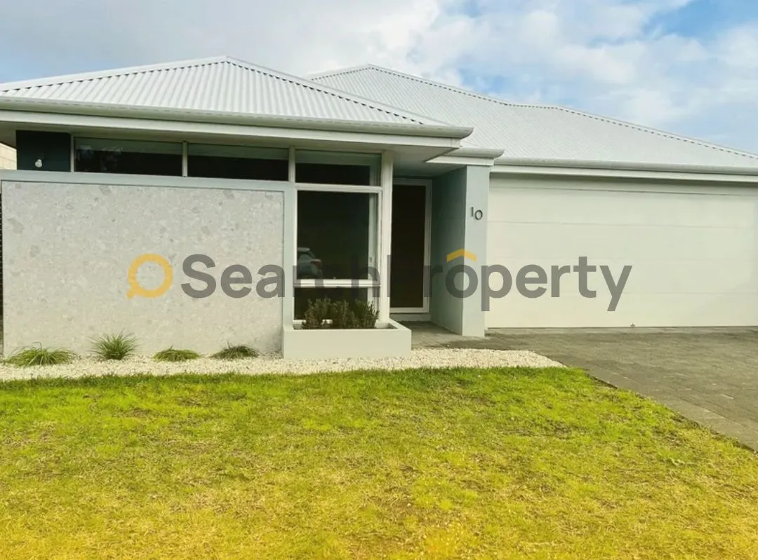 Modern single-level investment property with minimalist landscaping and a double garage in a quiet suburban area.