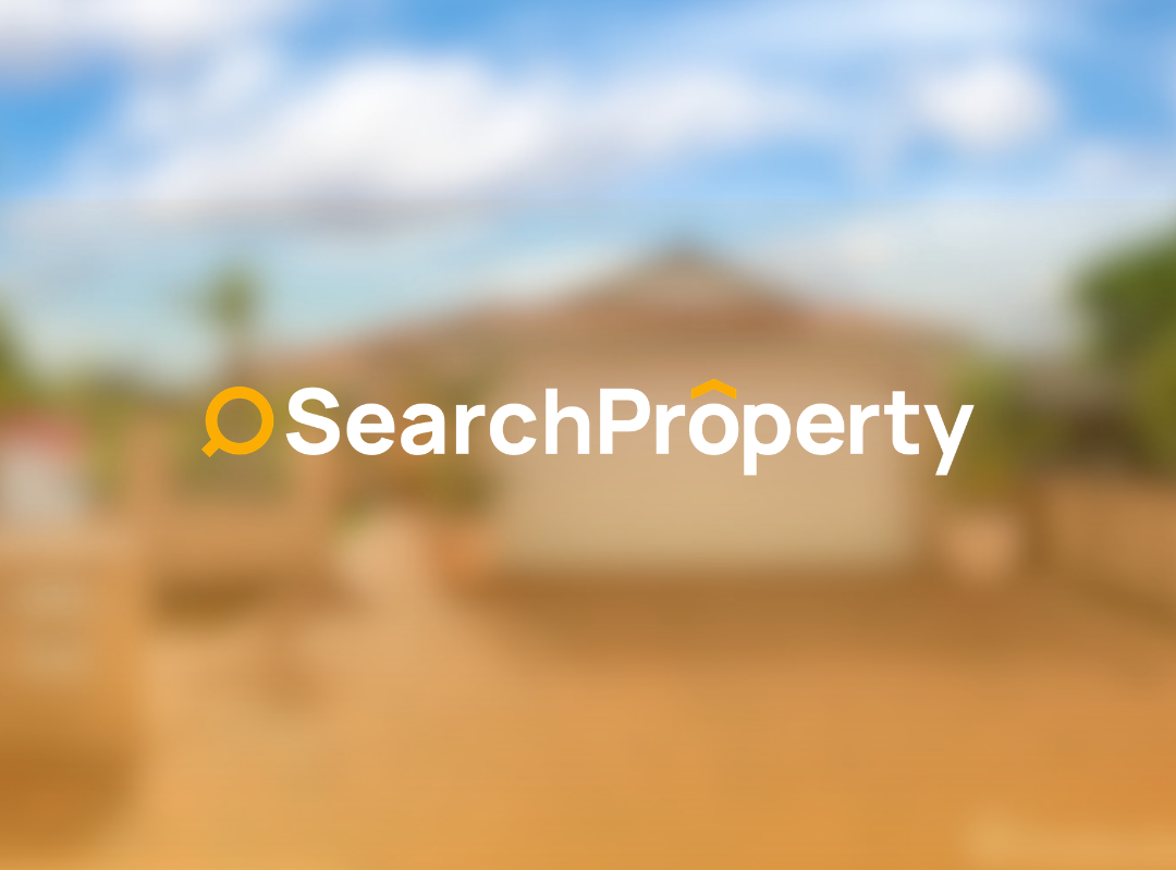 Modern single-storey brick home with double garage, paved driveway, and landscaped front yard in a suburban setting