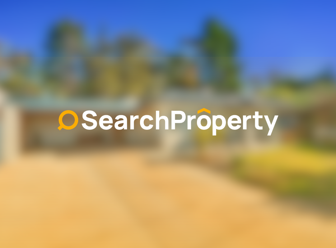 Modern Australian investment property featuring a contemporary single-storey home with a double garage, wide driveway, landscaped front lawn, and established trees.
